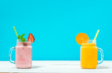 Jar of smoothie with fruits and milkshake, blended strawberry shake in jar, drink with vitamins and protein, healthy diet concept