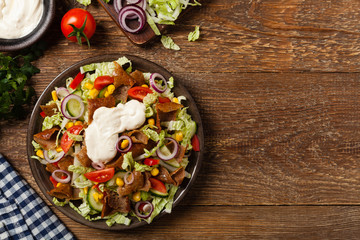 Gyros, kebeb. Salad with mutton and vegetables.