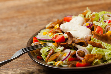 Gyros, kebeb. Salad with mutton and vegetables.