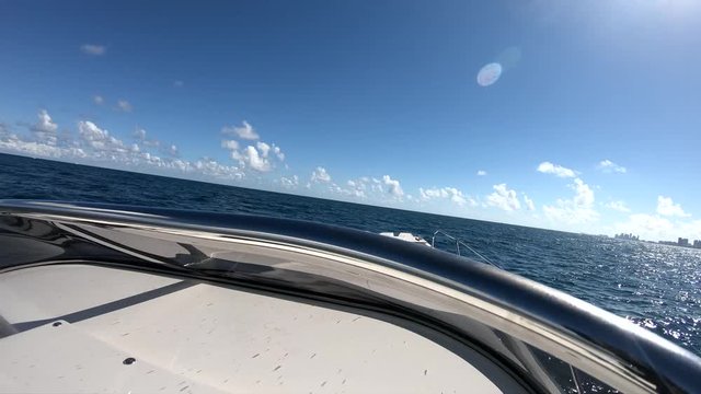 On board front view of a rib navigating fast on choppy sea.