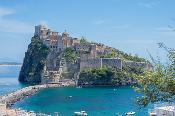 Ancient castle on the island in the blue sea