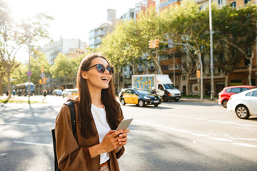 Amazing happy beautiful woman using mobile phone.