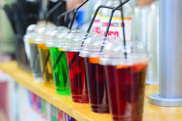 Cups with sparkling fresh natural fruit lemonades