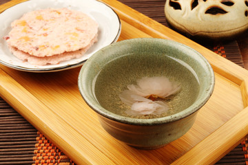 Sakura senbei and sakura tea on a tray © lcc54613