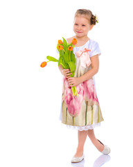 Little girl with a bouquet of tulips.