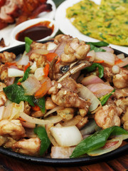 Sizzling bullfrog with vegetables served on iron plate