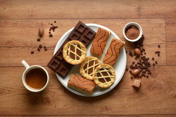 assorted chocolate foods in the wooden table