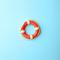 Safety equipment, life buoy or rescue buoy on blue background, minimal summer concept