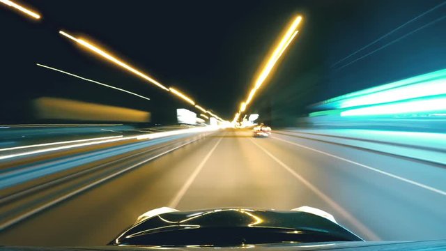 Car driving in night city, time-lapse. Reckless driving, speeding, pursuit. Night city driving, long exposure