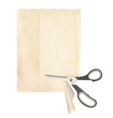 Scissors cut a sheet of old paper