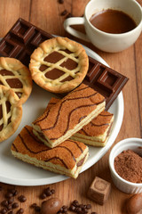 assorted chocolate foods in the wooden table