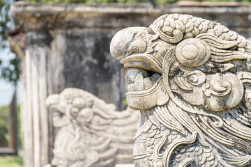 Closeup view of stone sculpture of dragon in Hue