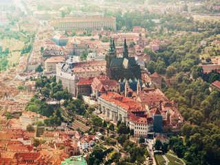 Fototapeta na wymiar Aerial view on Prague Castle and Saint Vitus Cathedral, Czech Republic. Panoramic view from airplane.