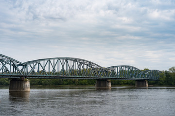 Fototapeta na wymiar Truss road bridge over Vistula river in Torun, Poland.