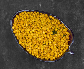 Indian Traditional Namkeen Food Chana Masala on Dark Background