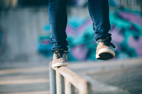 Legs walking on steel pipe with balance