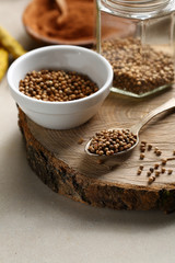 Coriander seeds spice on wood