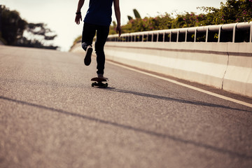 Skateboarder skateboarding on city street