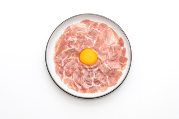 fresh sliced pork raw with egg for cooking or making shabu shabu and sukiyaki