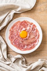 fresh sliced pork raw with egg