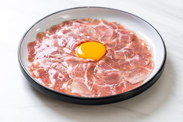 fresh sliced pork raw with egg