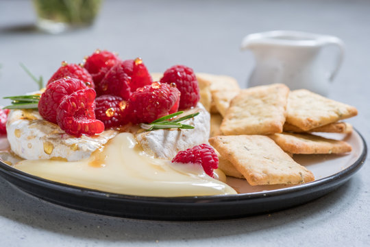 Baked Camembert cheese with raspberry