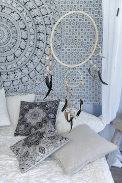 Dream Catcher Over The Bed./The Dream Catcher Over The Bed With Pillows In Scandinavian Style.