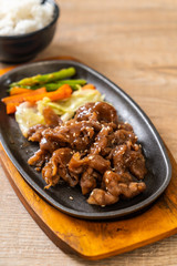 sliced pork steak on hot plate