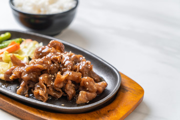 sliced pork steak on hot plate