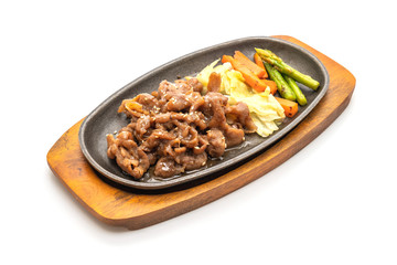 sliced pork steak on hot plate
