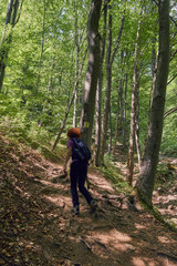 Woman hiking on a mountain trail