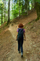 Woman hiking on a mountain trail