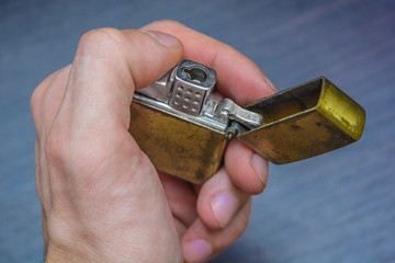 hand-held golden folding lighter
