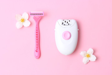 modern epilator and razor on a colored background. Removal of unwanted hair. Minimalism, choice, top.