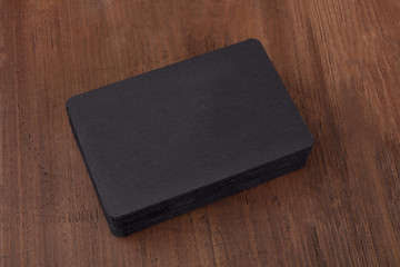 Black business cards mockup on a dark background