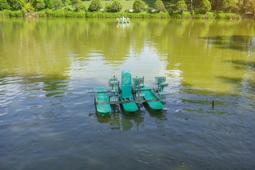 Paddlewheel aerators in a water pond, Bueng Kan Province, Thailand