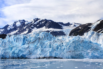 Alaska, USA: Close up of glacier with ice floes on the water