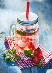 Fruit and berry infused punch in a glass jar