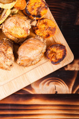 Top view of healthy and delicious dinner made of fried chicken and grilled vegetables