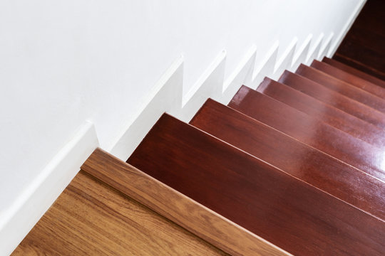 Hardwood stair steps and white wall, interior stairs material and home design