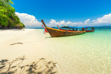 White sand beach and Long-tail boat at Khang Khao Island (Bat island), The beautiful sea Ranong Province, Thailand.