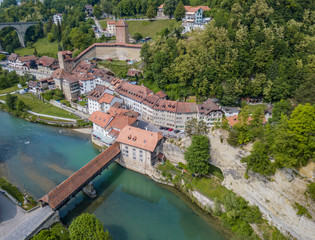 Fototapeta na wymiar Aerial view of old medieval city of Fribourg in Switzerland on a beautiful summer day