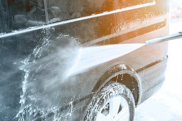 Manual car wash. Washing luxury vehicle with high pressure water pump.Automobile  cleaning self...