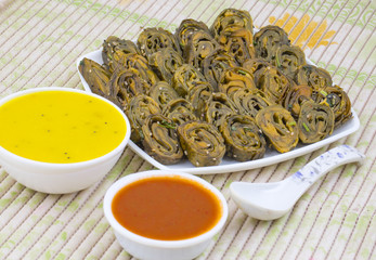 Indian Spicy Food Patra Also Called Paatra, Alu Vadi or Patrode is a Veg Dish in Maharashtra or Gujarati Cuisine. It is Made from Colocasia Leaves Stuffed with Rice Flour And Spices, Tamarind, Jaggery