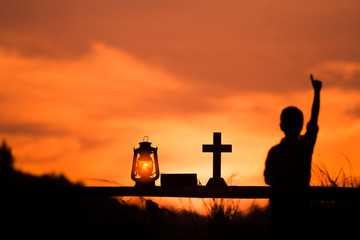 Boy lift hand to worship God, christian concept