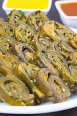 Indian Spicy Food Patra Also Called Paatra, Alu Vadi or Patrode is a Veg Dish in Maharashtra or Gujarati Cuisine. It is Made from Colocasia Leaves Stuffed with Rice Flour And Spices, Tamarind, Jaggery