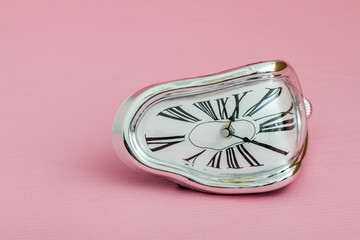 Clock with Distorted Soft Melting Design on Pink Background