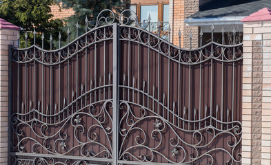 Brown iron double gates for car entry