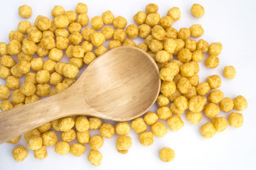 wheat and honey cereals on white background and spoon