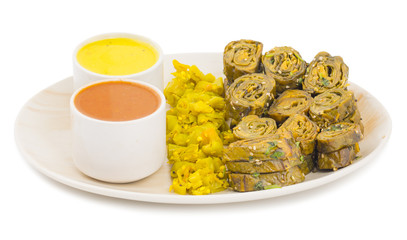 Indian Spicy Food Patra Also Called Paatra, Alu Vadi or Patrode is a Veg Dish in Maharashtra or Gujarati Cuisine. It is Made from Colocasia Leaves Stuffed with Rice Flour And Spices, Tamarind, Jaggery